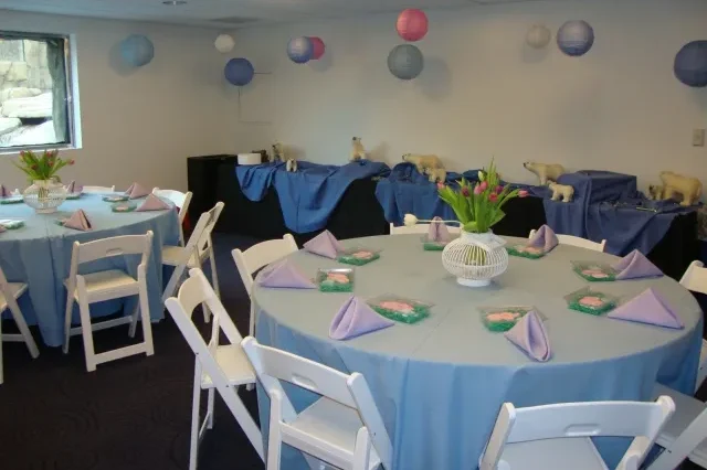 Water's Edge Conference room set up with round tables and buffet tables along the back wall.